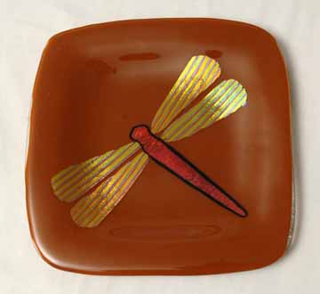 Red Dragonfly on Brown Plate