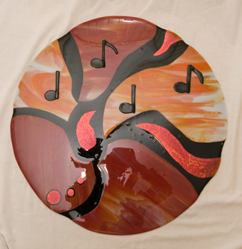 Red and Orange on Black with musical notes and red dichroic glass